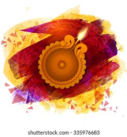 Glossy illuminated oil lit lamp on colourful creative background for Indian Festival of Lights, Happy Diwali celebration.