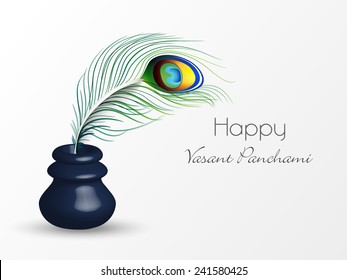 Glossy ink pot with peacock feather on white background for Happy Vasant Panchami celebration.