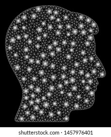 Glossy mesh man head with glitter effect. Abstract illuminated model of man head icon. Shiny wire frame polygonal mesh man head. Vector abstraction on a black background.