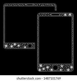 Glossy mesh mobile devices with glitter effect. Abstract illuminated model of mobile devices icon. Shiny wire carcass triangular mesh mobile devices. Vector abstraction on a black background.