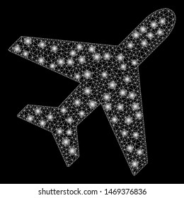 Glossy mesh plane with glare effect. Abstract illuminated model of plane icon. Shiny wire carcass triangular mesh plane. Vector abstraction on a black background.