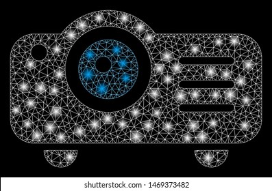 Glossy mesh projector with glare effect. Abstract illuminated model of projector icon. Shiny wire carcass polygonal mesh projector. Vector abstraction on a black background.
