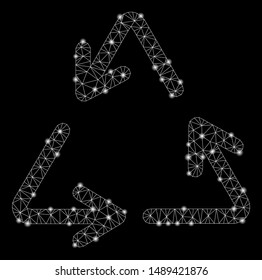 Glossy mesh recycle with glitter effect. Abstract illuminated model of recycle icon. Shiny wire carcass polygonal mesh recycle. Vector abstraction on a black background.