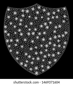 Glossy mesh shield with glow effect. Abstract illuminated model of shield icon. Shiny wire frame triangular mesh shield. Vector abstraction on a black background.