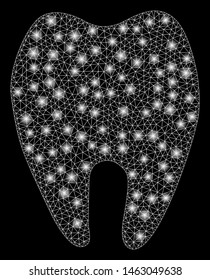 Glossy mesh tooth with glare effect. Abstract illuminated model of tooth icon. Shiny wire carcass polygonal mesh tooth. Vector abstraction on a black background.