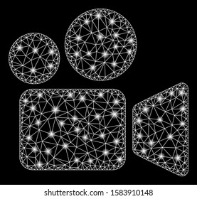Glossy mesh video camera with glare effect. Abstract illuminated model of video camera icon. Shiny wire frame polygonal mesh video camera. Vector abstraction on a black background.