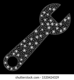 Glossy mesh wrench with glow effect. Abstract illuminated model of wrench icon. Shiny wire frame triangular mesh wrench. Vector abstraction on a black background.