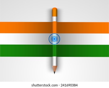 Glossy pencil in national tricolor on grey background for Indian Republic Day celebration.