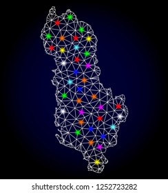 Glossy polygonal mesh map of Albania with glow effect. Vector carcass map of Albania with glowing multi colored points for New Year illustrations. White mesh lines. Dark blue background.