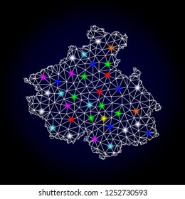 Glossy polygonal mesh map of Altai Republic with glow effect. Vector carcass map of Altai Republic with glowing multi colored dots for New Year templates. White mesh lines. Dark blue background.