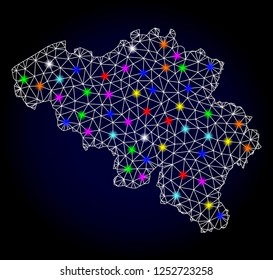 Glossy polygonal mesh map of Belgium with glare effect. Vector carcass map of Belgium with glowing multi colored points for Christmas posters. White mesh lines. Dark blue background.