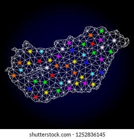 Glossy polygonal mesh map of Hungary with glow effect. Vector carcass map of Hungary with glowing multi colored dots for New Year posters. White mesh lines. Dark blue background. Constellation effect.