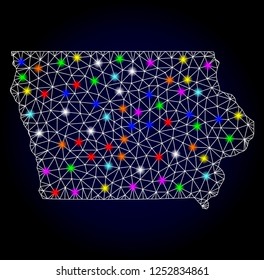 Glossy polygonal mesh map of Iowa State with glare effect. Vector carcass map of Iowa State with glowing multi colored dots for New Year illustrations. White mesh lines. Dark blue background.