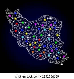 Glossy polygonal mesh map of Iran with glare effect. Vector carcass map of Iran with glowing multi colored points for New Year posters. White mesh lines. Dark blue background. Constellation effect.