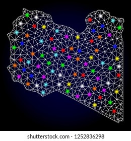 Glossy polygonal mesh map of Libya with glow effect. Vector carcass map of Libya with glowing multi colored spheres for New Year templates. White mesh lines. Dark blue background.