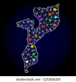 Glossy polygonal mesh map of Mozambique with glare effect. Vector carcass map of Mozambique with glowing multi colored points for New Year templates. White mesh lines. Dark blue background.