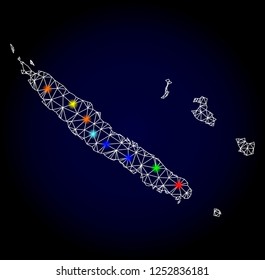 Glossy polygonal mesh map of New Caledonia with glow effect. Vector carcass map of New Caledonia with glowing multi colored dots for New Year templates. White mesh lines. Dark blue background.