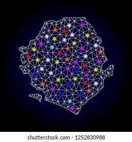 Glossy polygonal mesh map of Sierra Leone with glare effect. Vector carcass map of Sierra Leone with glowing multi colored spheres for Christmas purposes. White mesh lines. Dark blue background.