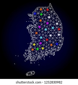 Glossy polygonal mesh map of South Korea with glow effect. Vector carcass map of South Korea with glowing multi colored points for Christmas templates. White mesh lines. Dark blue background.