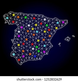Glossy polygonal mesh map of Spain with glow effect. Vector carcass map of Spain with glowing colorful dots for New Year illustrations. White mesh lines. Dark blue background. Constellation effect.