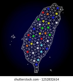 Glossy polygonal mesh map of Taiwan with glare effect. Vector carcass map of Taiwan with glowing multi colored points for Christmas illustrations. White mesh lines. Dark blue background.