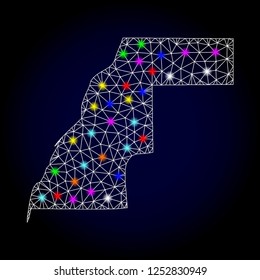 Glossy polygonal mesh map of Western Sahara with glow effect. Vector carcass map of Western Sahara with glowing multi colored dots for Christmas purposes. White mesh lines. Dark blue background.