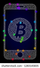 Glossy polygonal mesh mobile bitcoin bank icon with glow effect on a dark background. Carcass mobile bitcoin bank iconic vector with illuminated multi colored points in rainbow colors.