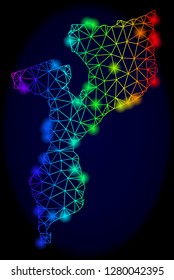 Glossy rainbow mesh vector map of Mozambique with glare effect. Abstract lines, triangles, light spots forms map of Mozambique on a dark background.