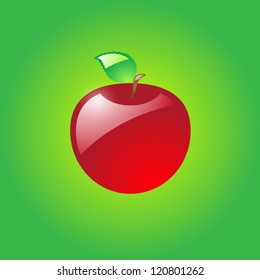 Glossy red apple on green background