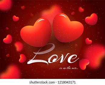 Glossy red hearts decorated blurred background with stylish lettering of Love. Can be used as Valentine Day greeting card design.