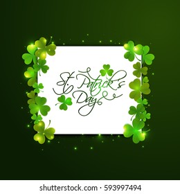 Glossy Shamrock leaves decorated, White board with text St. Patrick's Day. Elegant greeting or invitation card design.