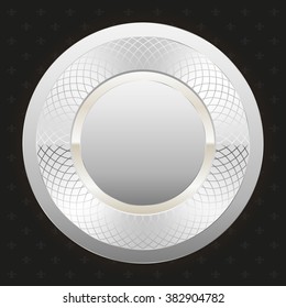 Glossy silver badge on black background