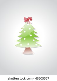 glossy small xmas tree isolated on grey background