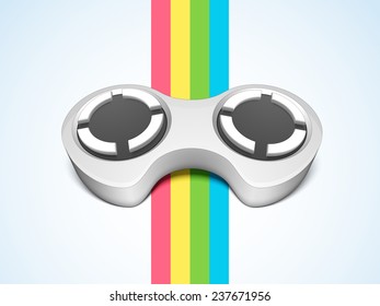 Glossy video game remote control in grey color on colorful paper stripes.