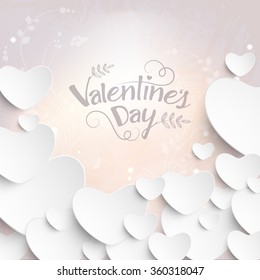 Glossy white hearts on shiny floral design decorated background for Happy Valentine's Day celebration.