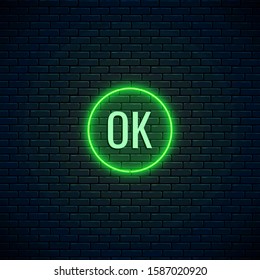 Glow neon OK button for internet design. Website acceptance button on dark brick wall background. Vector shiny design element. Action signs for internet use.