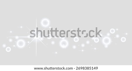 Glowing abstract light orbs and starbursts on soft grey background.