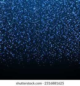 Glowing background of sparkling particles. Christmas concept. Blue glitter light effect. Luxury light background.