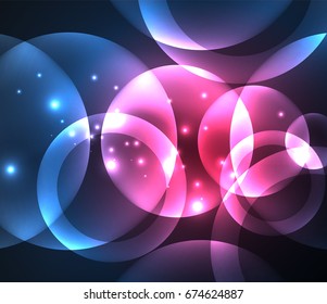 Glowing blue and purple colors shiny overlapping circles composition on dark background, magic style light effects abstract design template