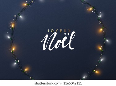 Glowing Christmas lights Wreath for Xmas Holiday greeting cards design. French text Joyeux Noel. (Translation Happy New Year and Merry Christmas)