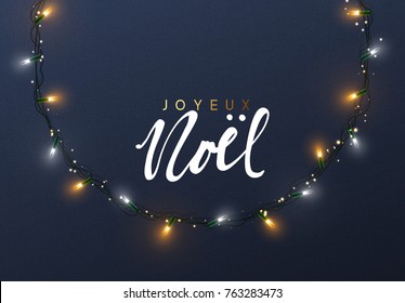 Glowing Christmas lights Wreath for Xmas Holiday greeting cards design. French text Joyeux Noel.