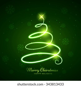glowing christmas tree in green background