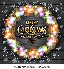 Glowing Christmas wreath made of led lights on the wooden background