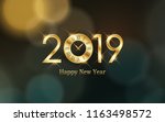 glowing Happy new year 2019 and clock with abstract bokeh and lens flare pattern in vintage color style background