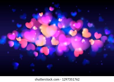 Glowing hearts with bokeh effect on a black background