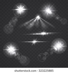 Glowing light effect stars and flashes on transparent background. Transparent stars.