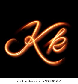 Glowing light letter K. Hand lighting painting