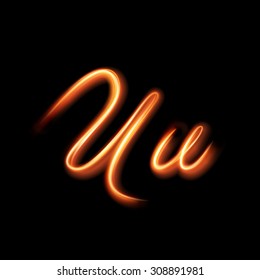 Glowing light letter U. Hand lighting painting