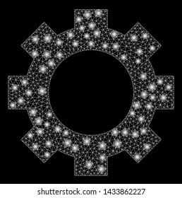Glowing mesh gear with lightspot effect. Abstract illuminated model of gear icon. Shiny wire frame polygonal mesh gear. Vector abstraction on a black background.