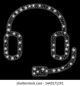 Glowing mesh headset with glitter effect. Abstract illuminated model of headset icon. Shiny wire carcass triangular mesh headset. Vector abstraction on a black background.
